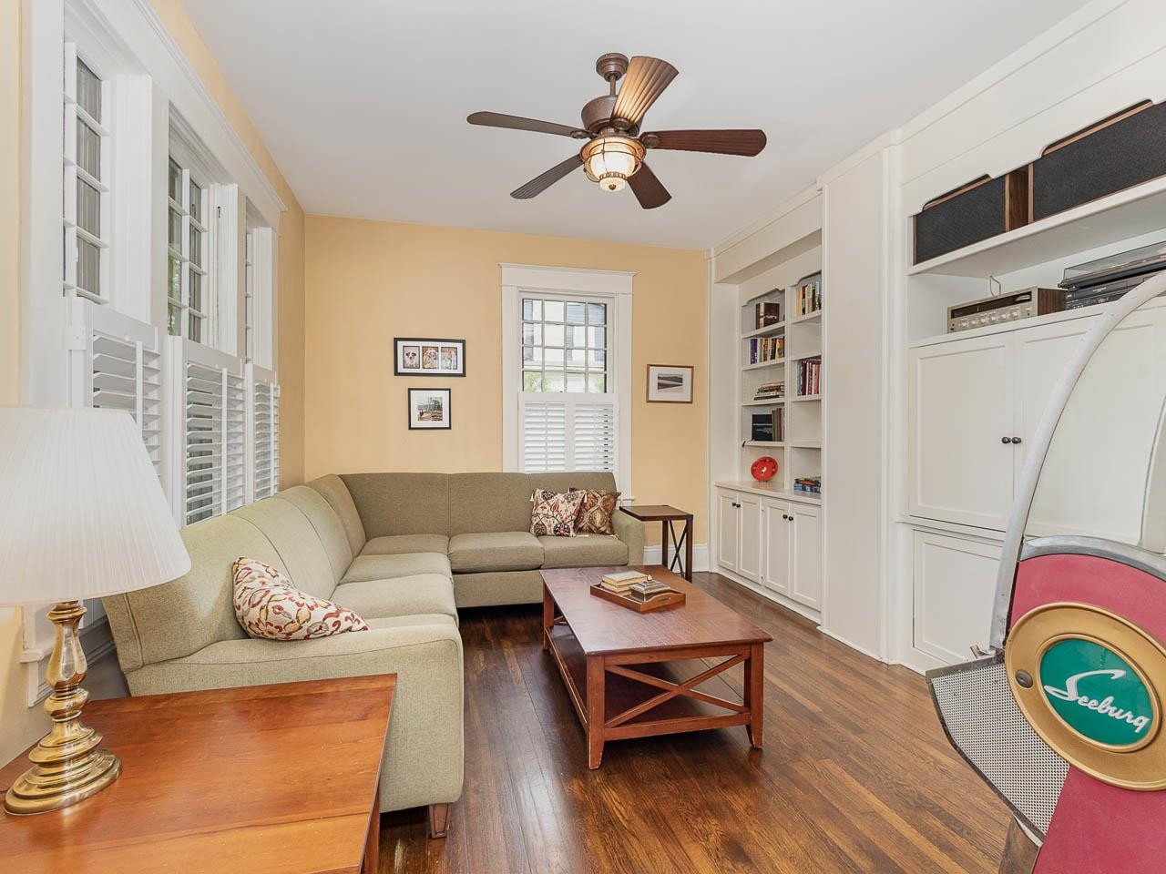 401 West Whitaker Mill Road Raleigh, NC 27608 - Photo 13 of 30 Comfortable room to sit and visit or watch TV in the enclosed cabinets. Wonderful bookshelves and nice wooden blinds here and much of the home. Family Room