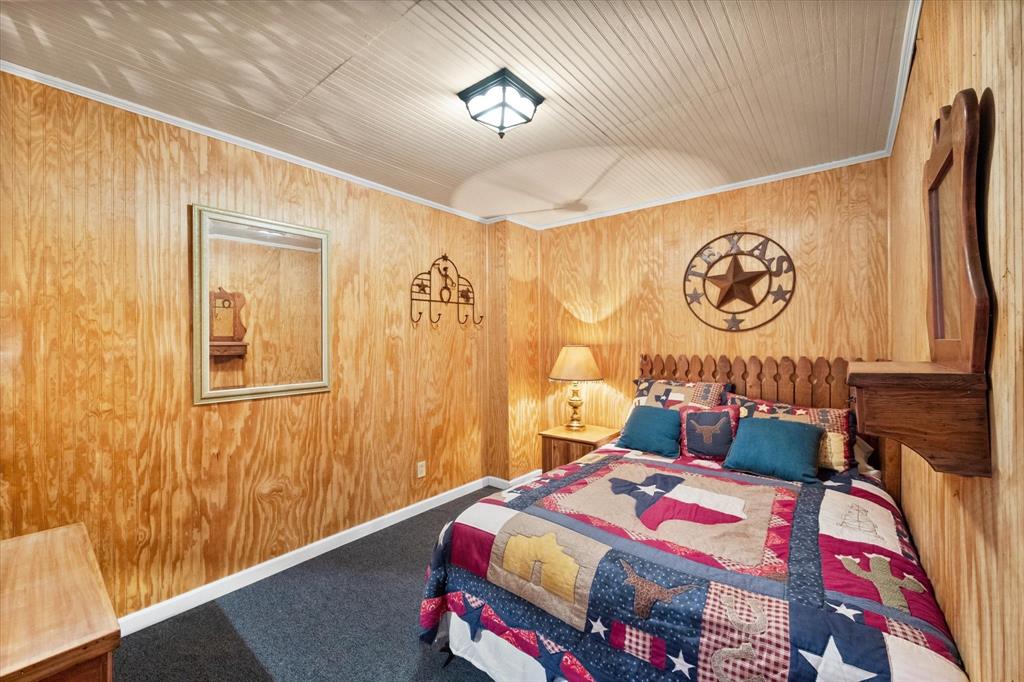 1209 Southwest County Road Corsicana, TX 75109 - Photo 12 of 27 a bedroom with a bed and a table