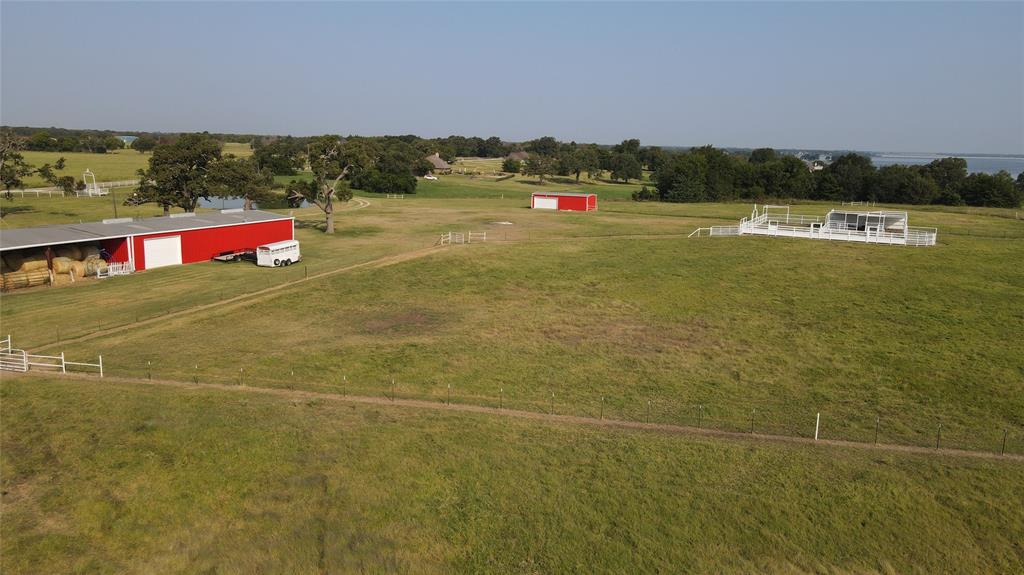 1209 Southwest County Road Corsicana, TX 75109 - Photo 18 of 27 a view of swimming pool and mountain in the background