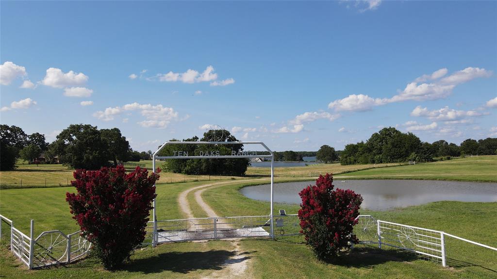 1209 Southwest County Road Corsicana, TX 75109 - Photo 2 of 27 a view of a swimming pool and outdoor seating