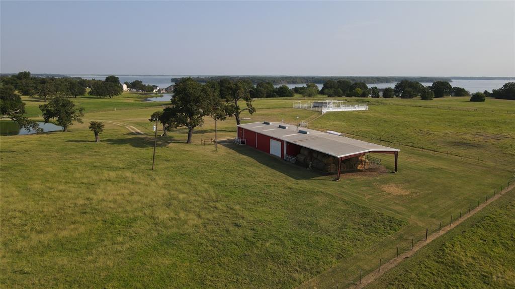 1209 Southwest County Road Corsicana, TX 75109 - Photo 22 of 27 a view of a lake with houses in the background