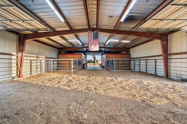 a view of empty room with wooden ceiling