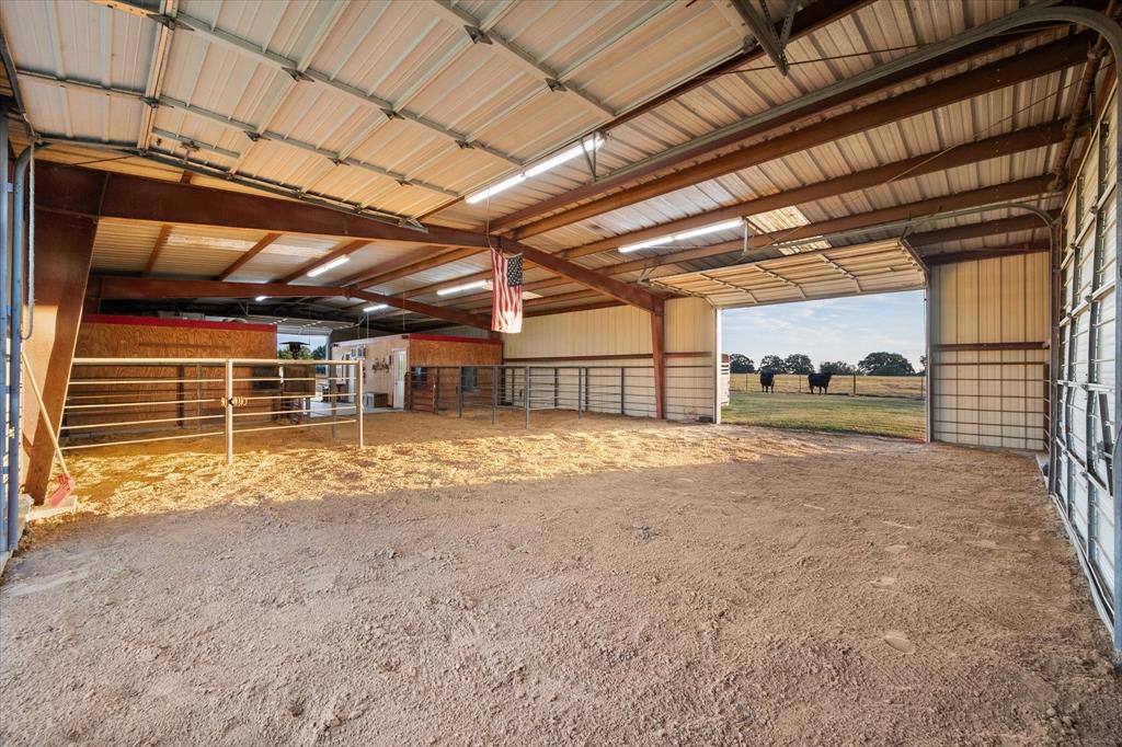 1209 Southwest County Road Corsicana, TX 75109 - Photo 9 of 27 a view of a empty room with wooden ceiling