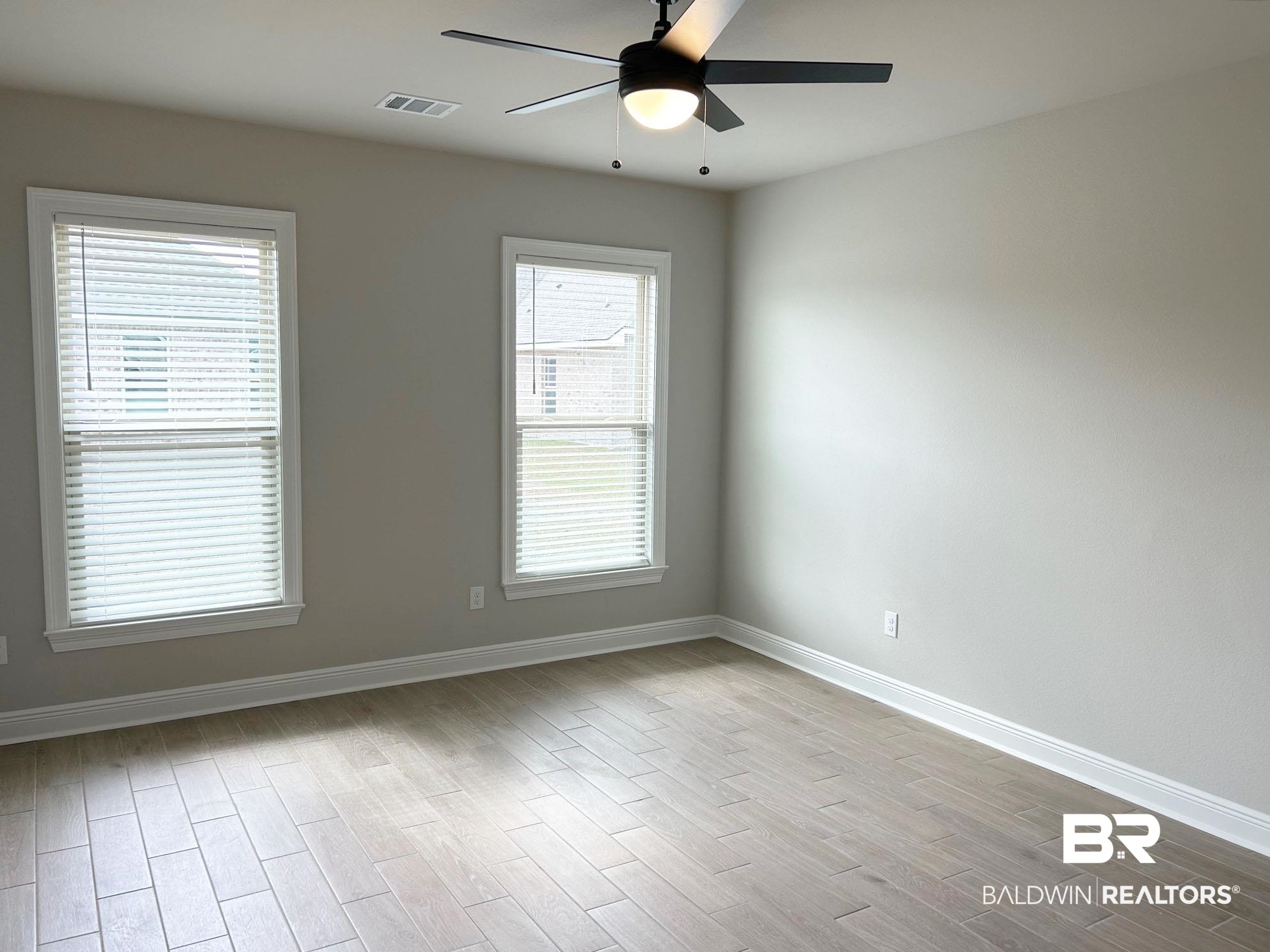 813 Sumter Loop Foley, AL 36535 - Photo 8 of 18 Empty room featuring ceiling fan and light hardwood / wood-style flooring