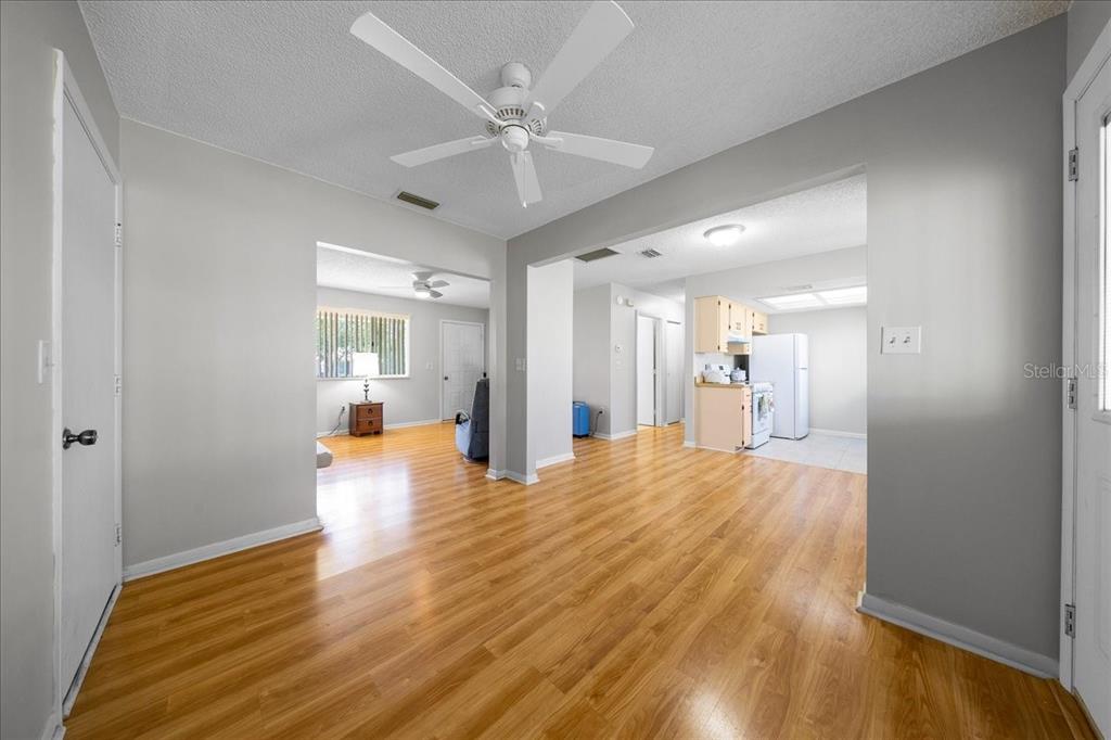 8445 Southwest 109th Street Ocala, FL 34481 - Photo 14 of 32 a view of empty room with wooden floor