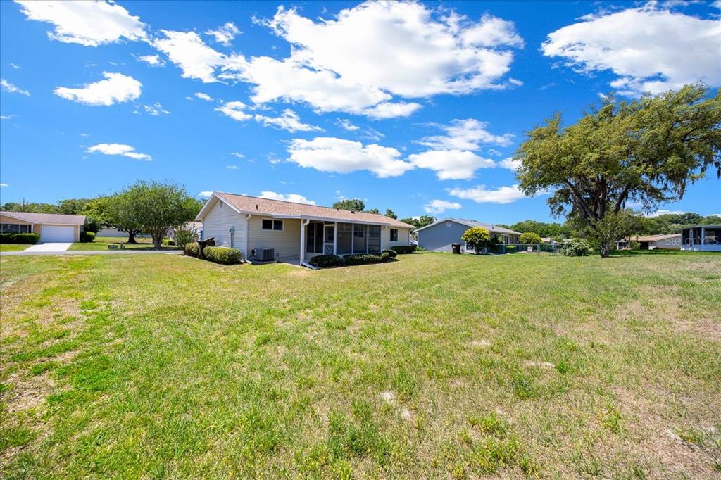 8445 Southwest 109th Street Ocala, FL 34481 - Photo 22 of 32 a front view of a house with a yard