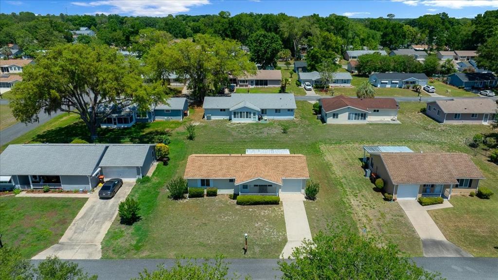 8445 Southwest 109th Street Ocala, FL 34481 - Photo 23 of 32 an aerial view of a house with garden space and street view