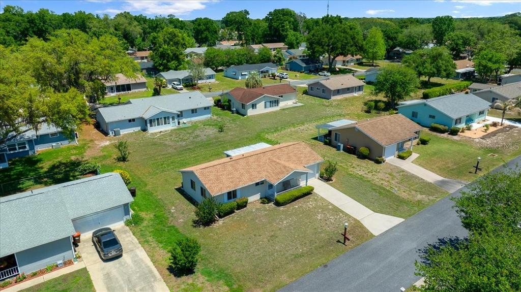 8445 Southwest 109th Street Ocala, FL 34481 - Photo 25 of 32 an aerial view of a house with garden space and street view