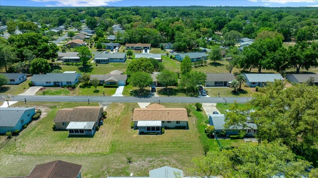 8445 Southwest 109th Street Ocala, FL 34481 - Photo 27 of 32 an aerial view of a house with yard swimming pool and outdoor seating