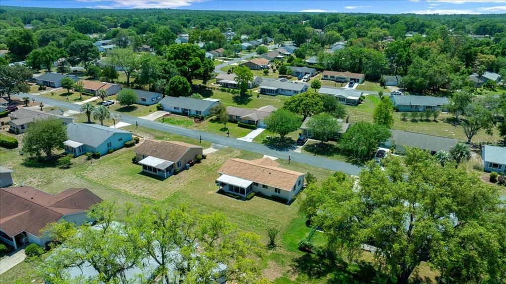 8445 Southwest 109th Street Ocala, FL 34481 - Photo 28 of 32 an aerial view of a house with yard swimming pool and outdoor seating