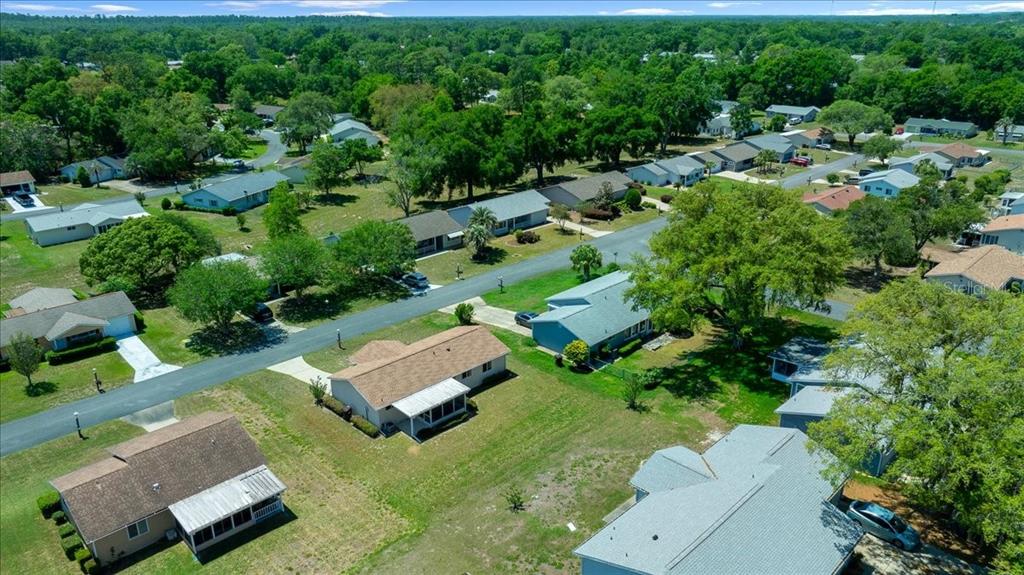 8445 Southwest 109th Street Ocala, FL 34481 - Photo 29 of 32 an aerial view of a house with a yard