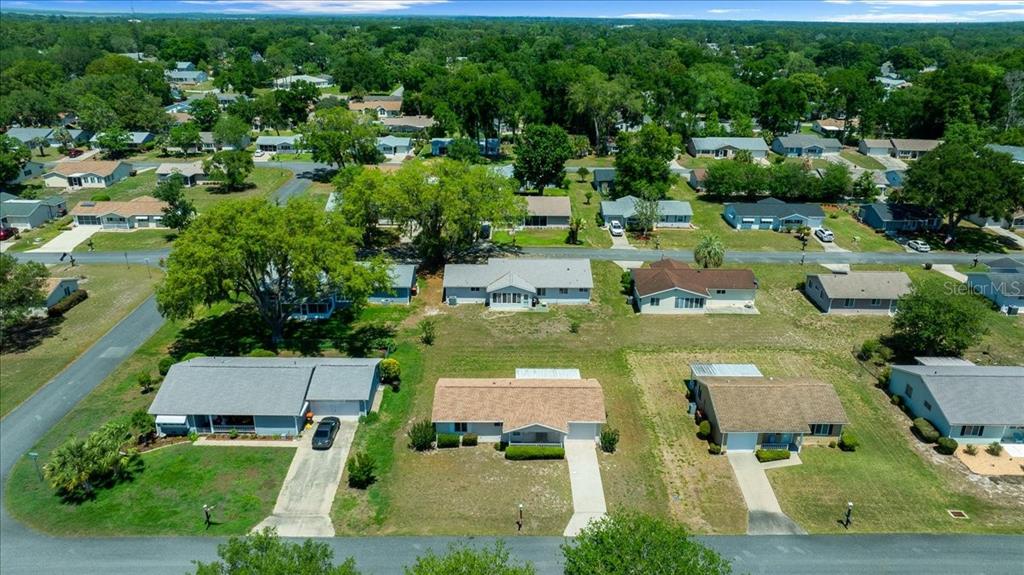 8445 Southwest 109th Street Ocala, FL 34481 - Photo 30 of 32 an aerial view of a house with yard swimming pool and outdoor seating