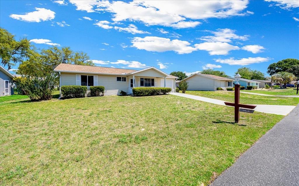 8445 Southwest 109th Street Ocala, FL 34481 - Photo 31 of 32 a view of a house with a yard