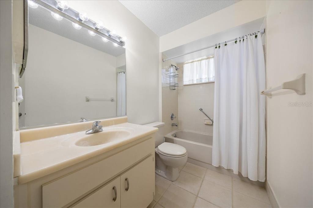 8445 Southwest 109th Street Ocala, FL 34481 - Photo 7 of 32 a bathroom with a sink a toilet and shower