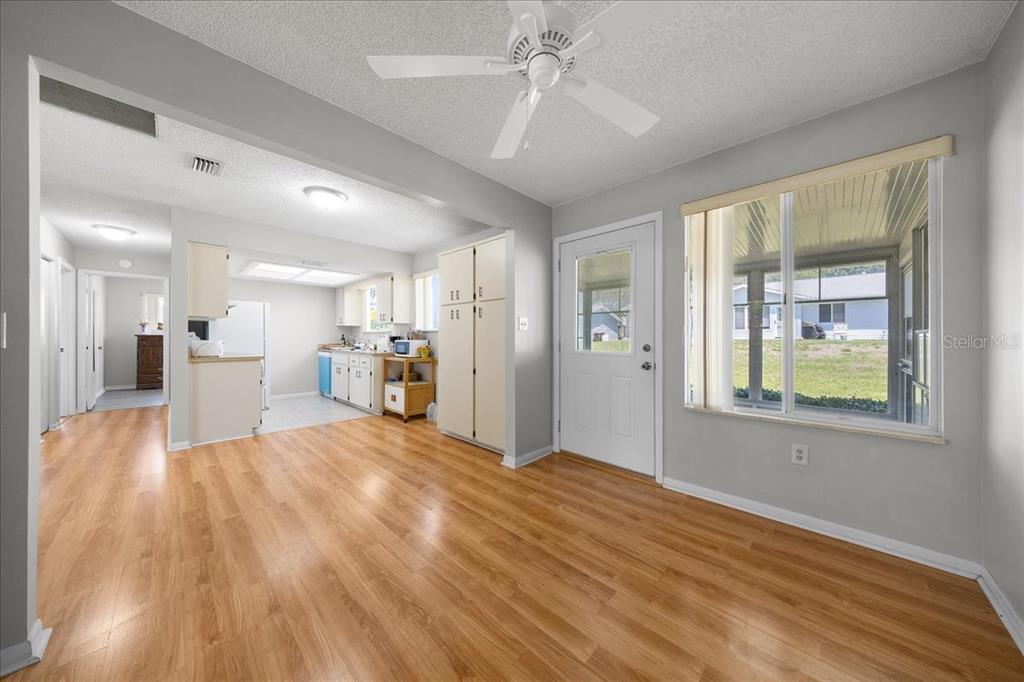 8445 Southwest 109th Street Ocala, FL 34481 - Photo 10 of 32 a view of an empty room with window and wooden floor