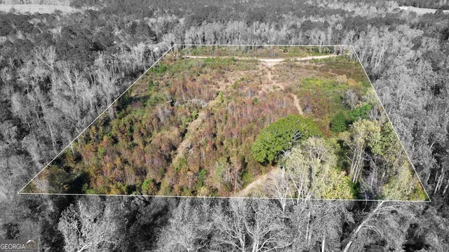 a view of swimming pool next to a yard
