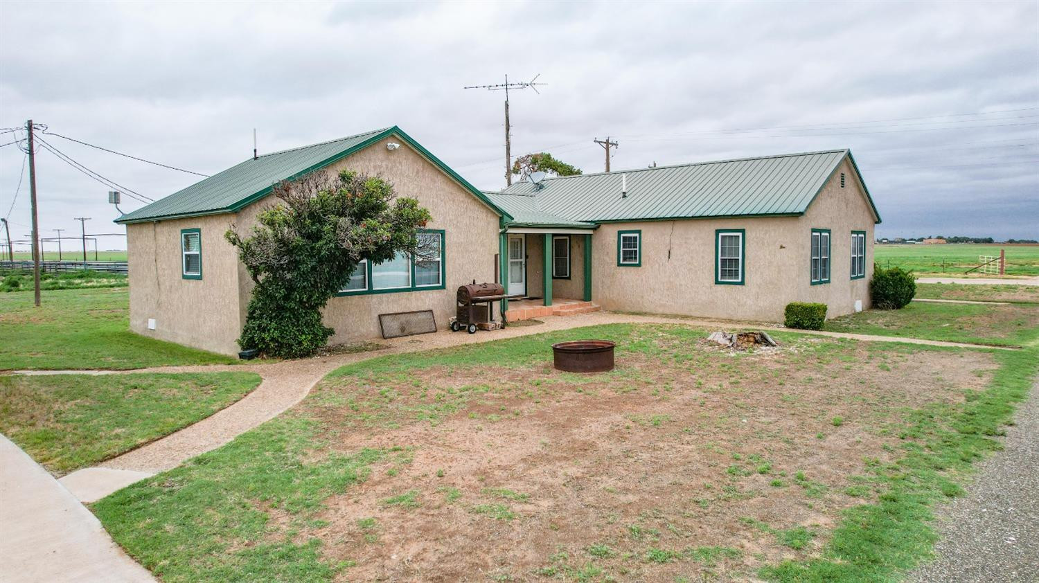 561 Farm To Market Road 302 Springlake, TX 79082 - Photo 2 of 38 a view of a house with a yard and plants