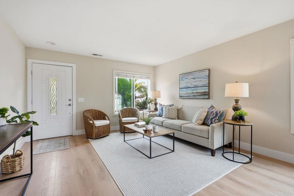 342 Rimhurst Court Oceanside, CA 92058 - Photo 16 of 53 a living room with furniture and wooden floor