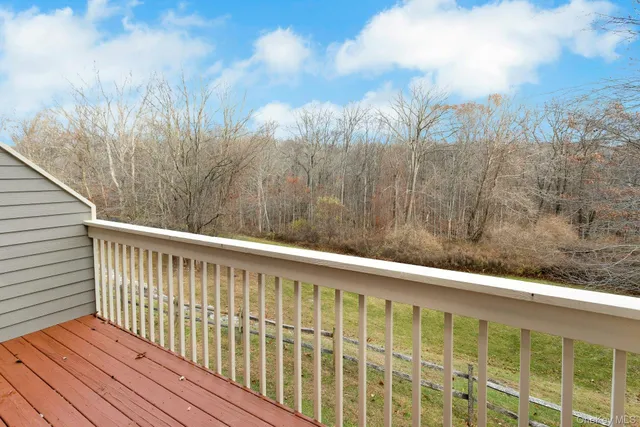 a view of wooden balcony with outdoor space