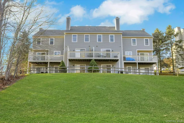 a front view of a building with a garden