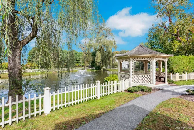a front view of a house with a yard table and chairs