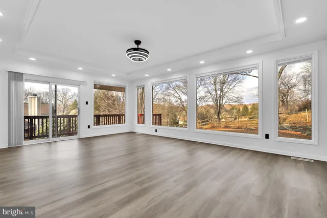 a view of an entryway with wooden floor