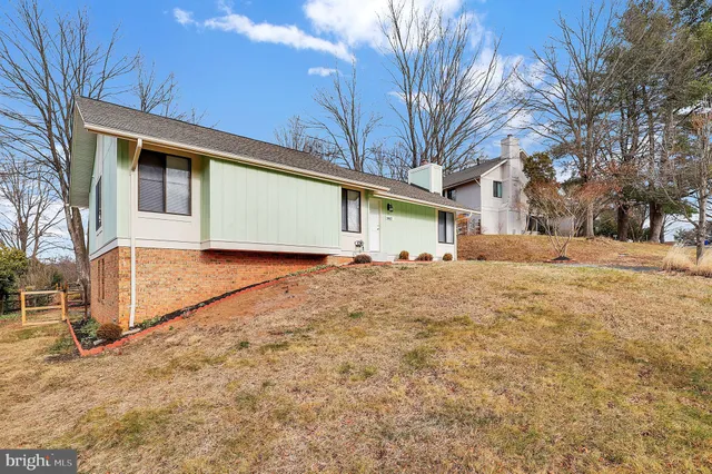 a backyard of a house with large trees
