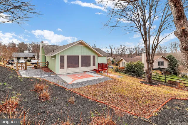 a view of a house with a snow on the road