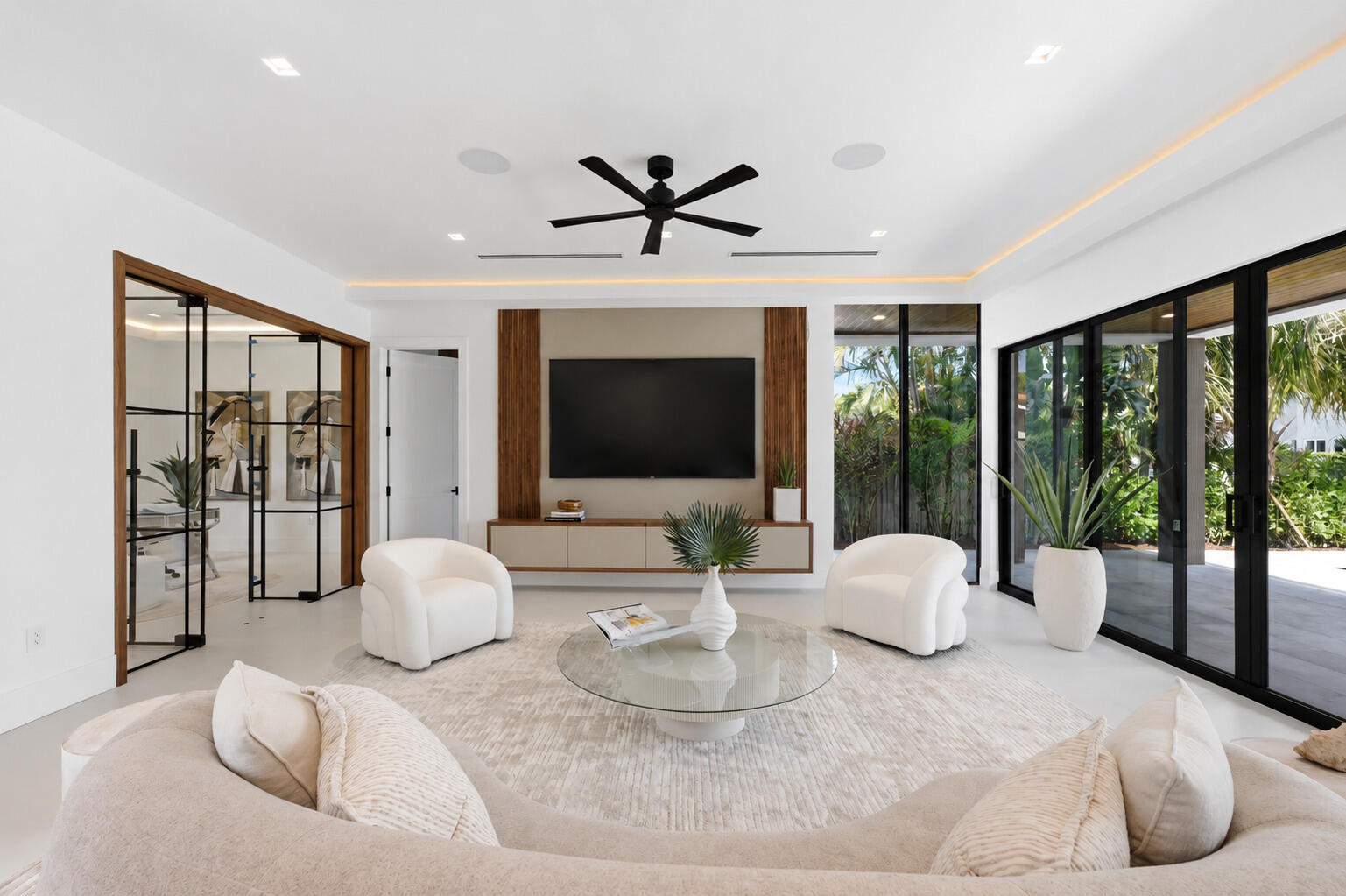 2360 Northeast 49th Street Lighthouse Point, FL 33064 - Photo 17 of 66 a living room with furniture a flat screen tv and a large window