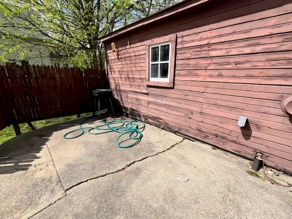 a view of a backyard with sitting area