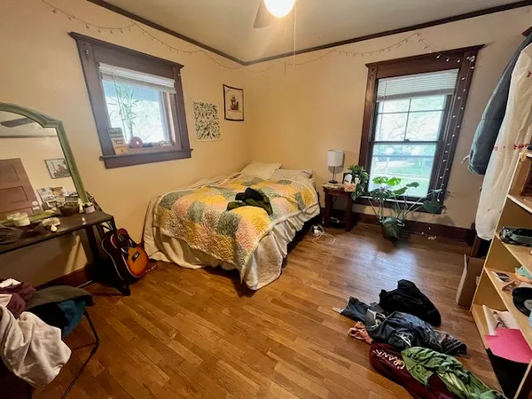 a bedroom with bed and a window