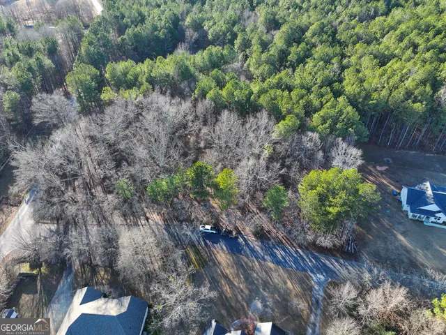 a backyard of a house with a yard with outdoor seating