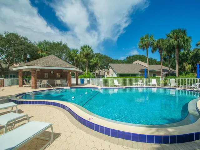 a view of a patio with a table and chairs