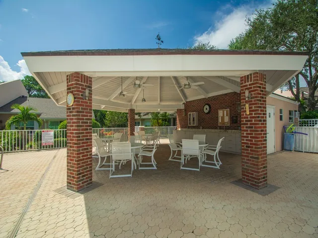 a view of a dining room with furniture wooden floor and chandelier