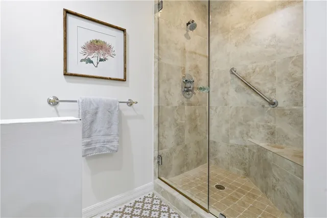 a bathroom with a shower and a sink