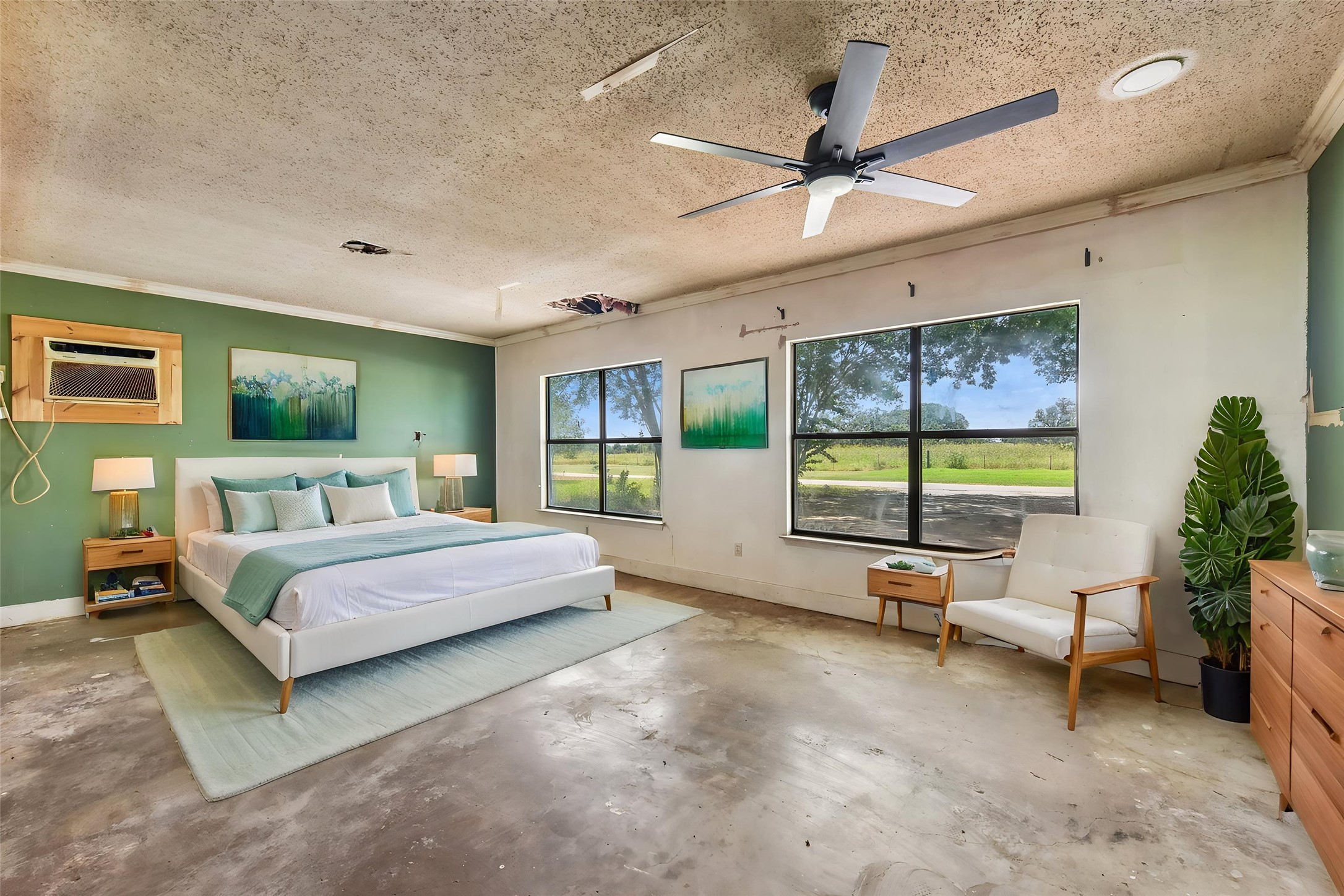 1111 Silent Valley Road Lockhart, TX 78644 - Photo 3 of 14 Natural light floods this spacious room through large windows, offering serene views of the outdoors.