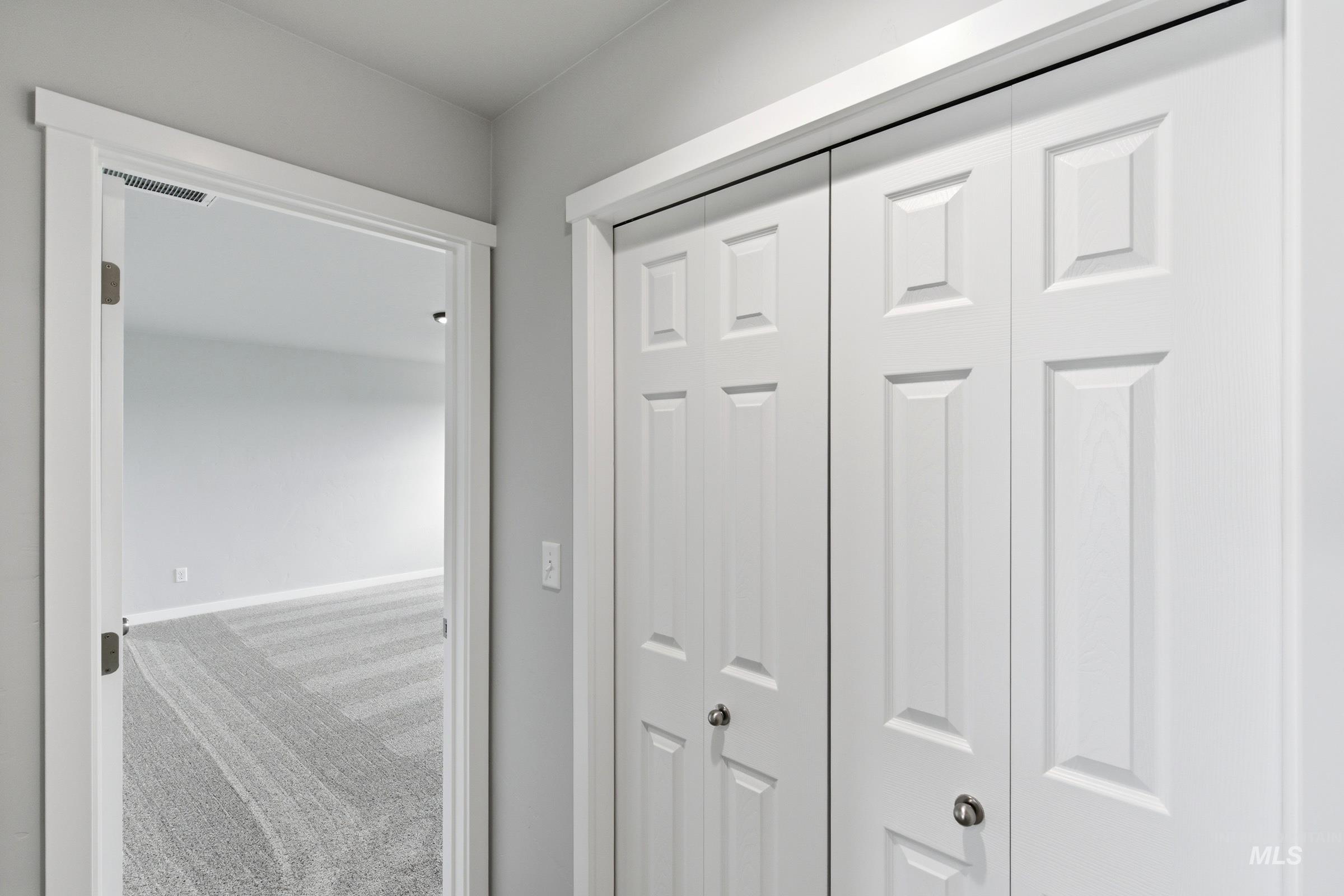 16558 Dunning Way Caldwell, ID 83607 - Photo 23 of 35 White interior doors featuring recessed paneling and brushed nickel hardware