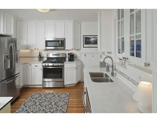 8 Winthrop Avenue Hull, MA 02045 - Photo 5 of 17 a kitchen with stainless steel appliances granite countertop a sink a stove a microwave and a refrigerator