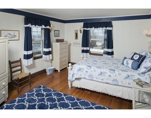 8 Winthrop Avenue Hull, MA 02045 - Photo 6 of 17 a bedroom with a bed window and dresser