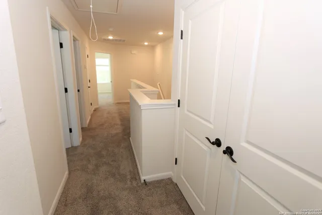 a view of a hallway with closet