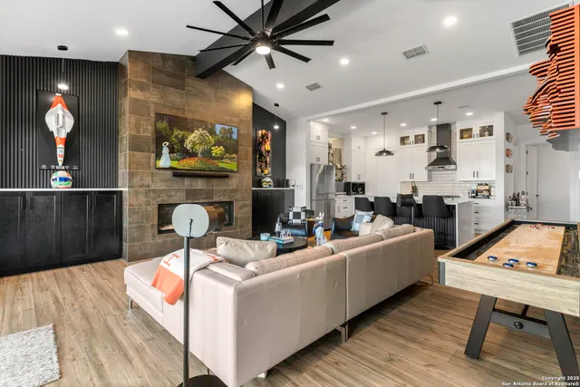 a living room with furniture and a fireplace