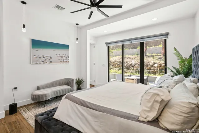 a spacious bathroom with double sink and a mirror