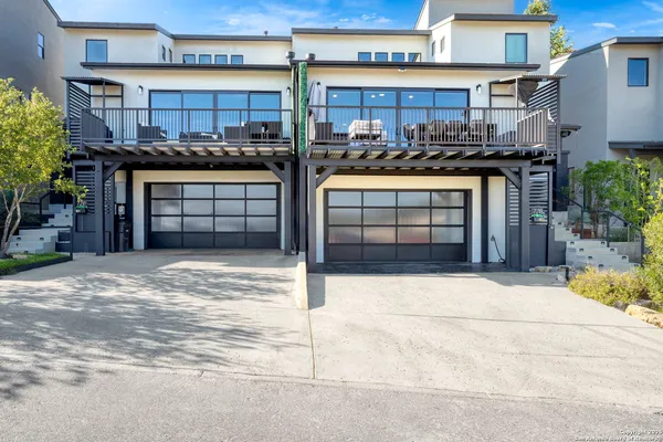 a front view of a house with a garage