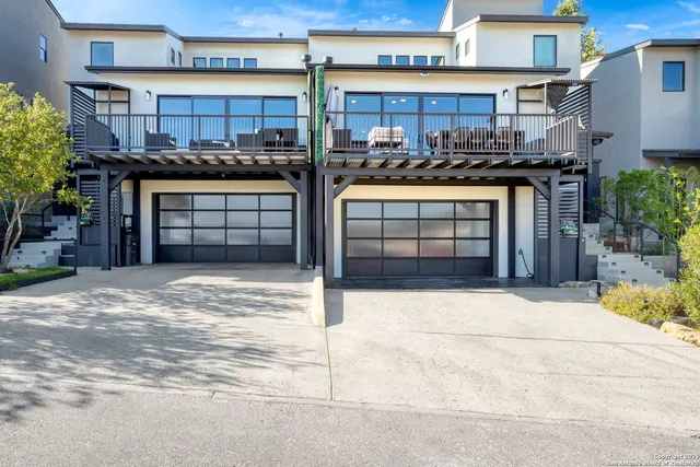 a front view of a house with a garage