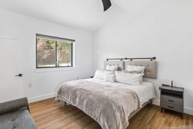 a bathroom with a sink a mirror a toilet and a bathtub