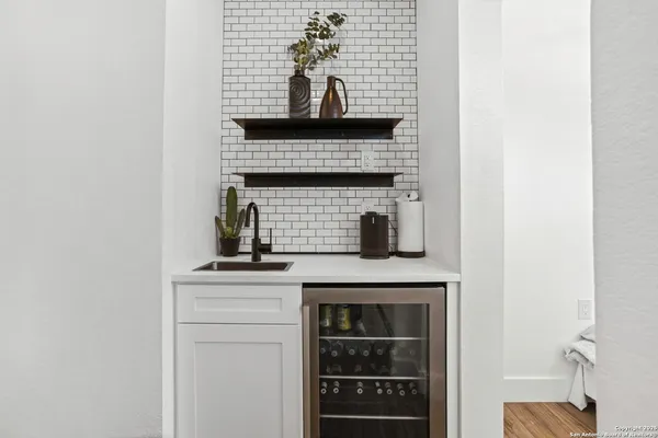 a room with furniture and a potted plant