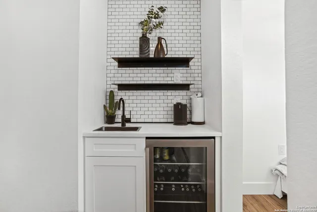 a room with furniture and a potted plant