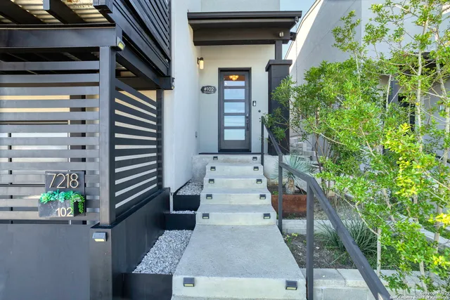 a view of entryway with wooden floor
