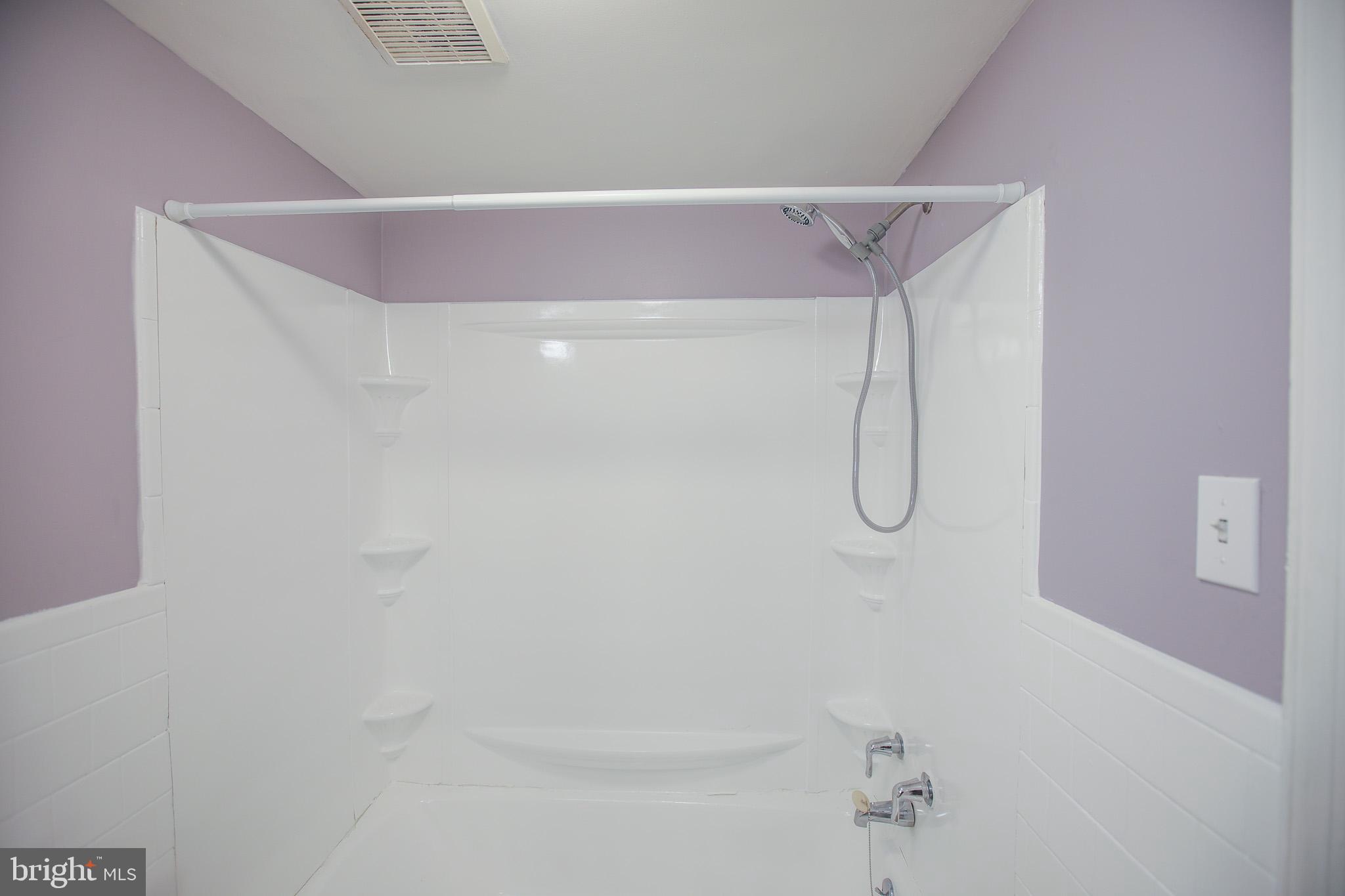 1705 Addison Road South District Heights, MD 20747 - Photo 13 of 26 a bathroom with a shower