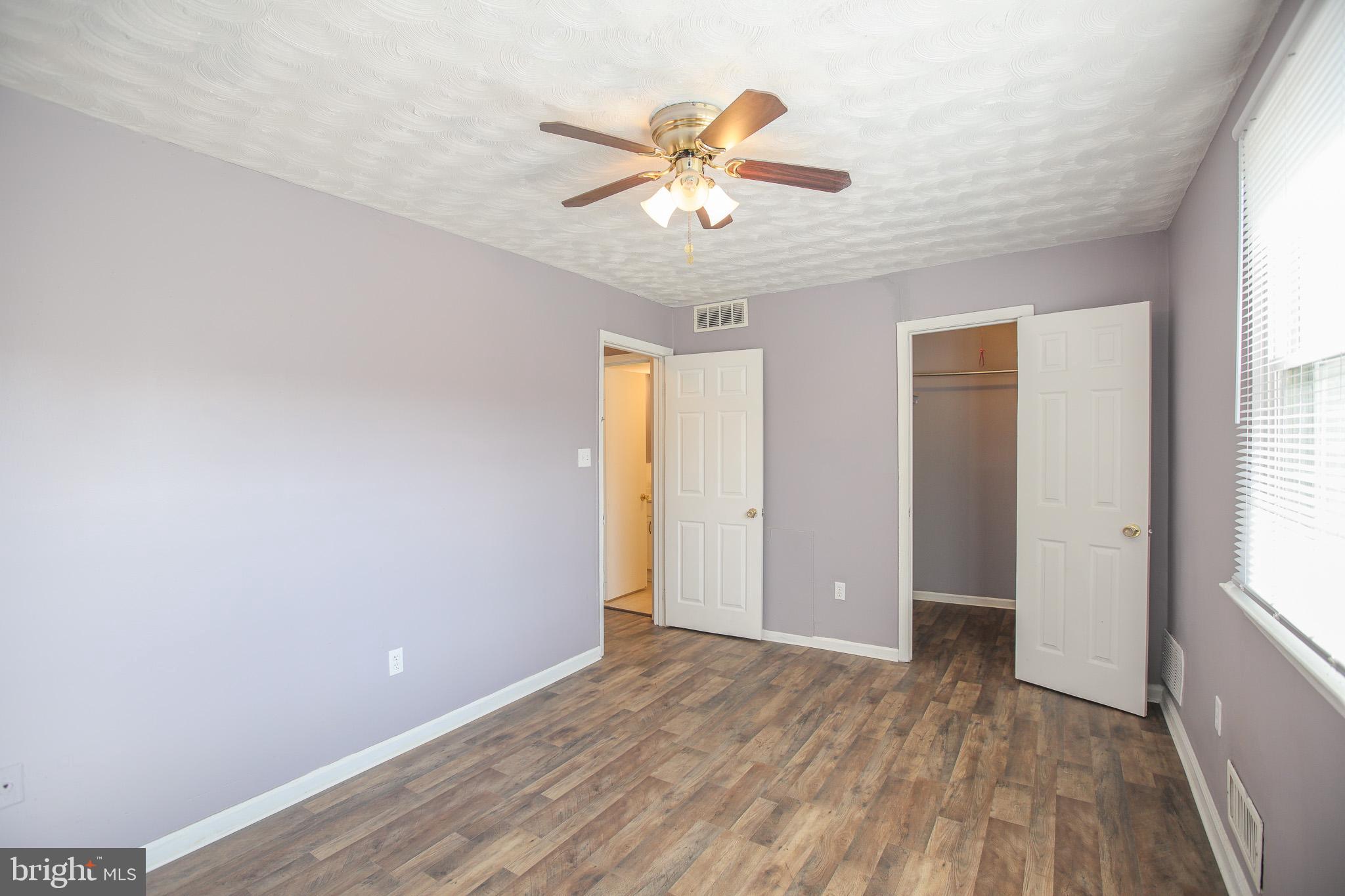 1705 Addison Road South District Heights, MD 20747 - Photo 15 of 26 wooden floor in an empty room with a window